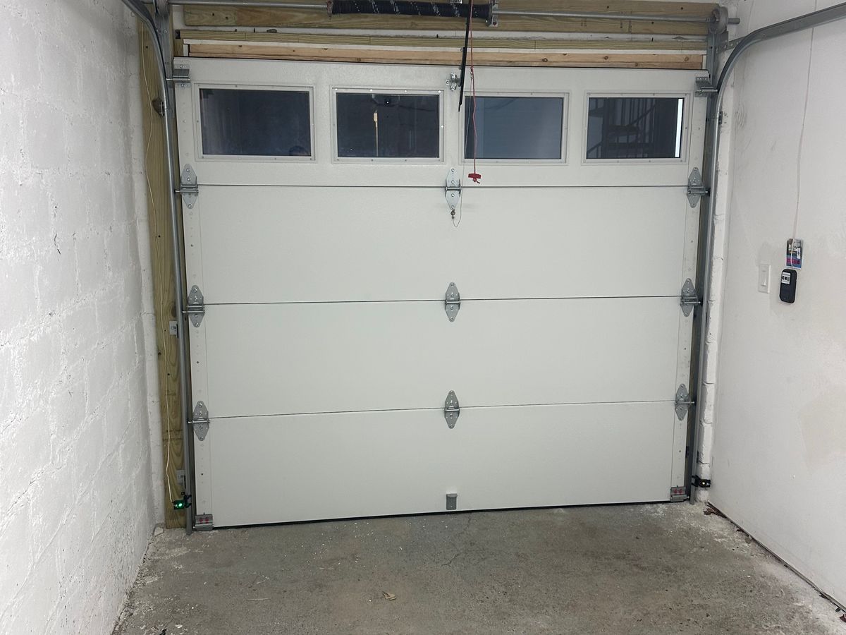 White commercial door with glass windows installed from interior view — Massachusetts